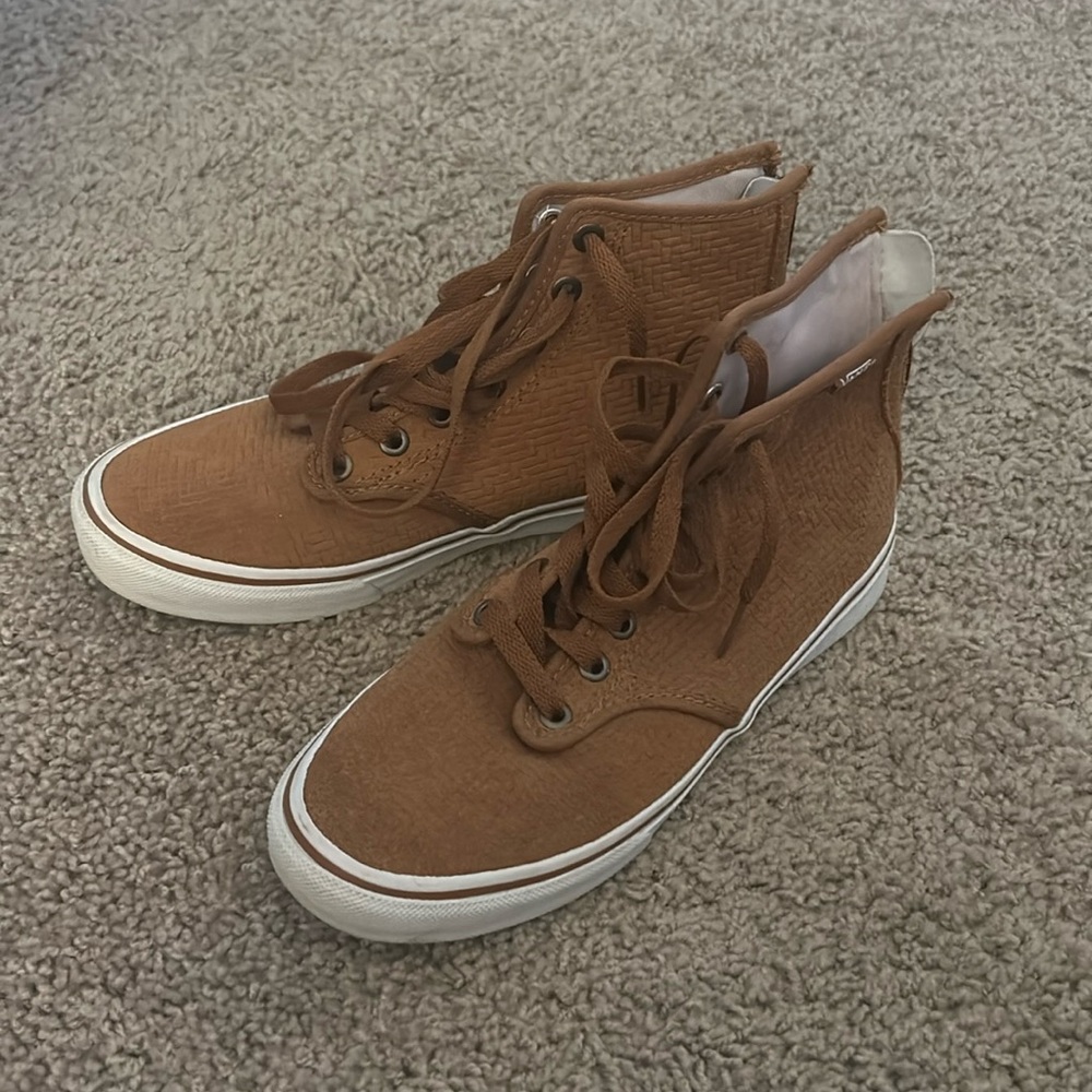 Vans high top sneakers. Zipper in back. Size women’s 6